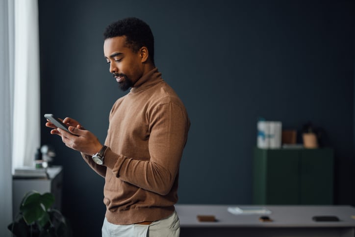 Businessman On Mobile Phone At Office